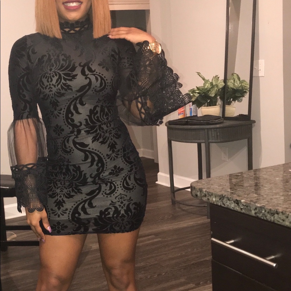 Black fitted sheet and lace long sleeve dress.